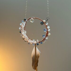 Handmade crescent moon charm.